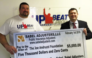 Jeff Sabel with a member of the Joe Andruzzi Foundation